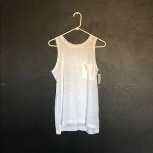 White tank top with front pocket.